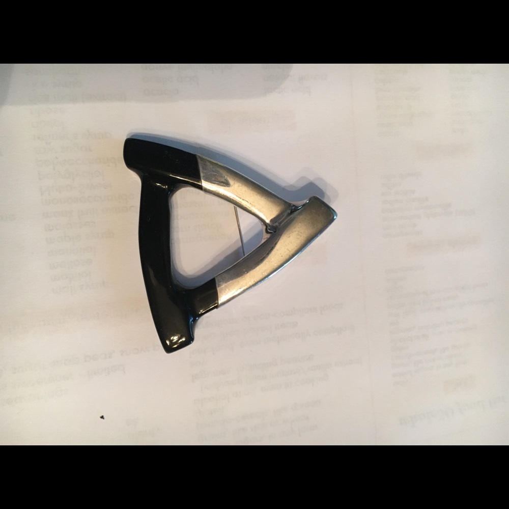 Silver and black brooch